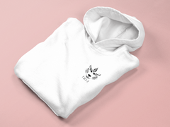 a white hoodie with a black and white bird on it