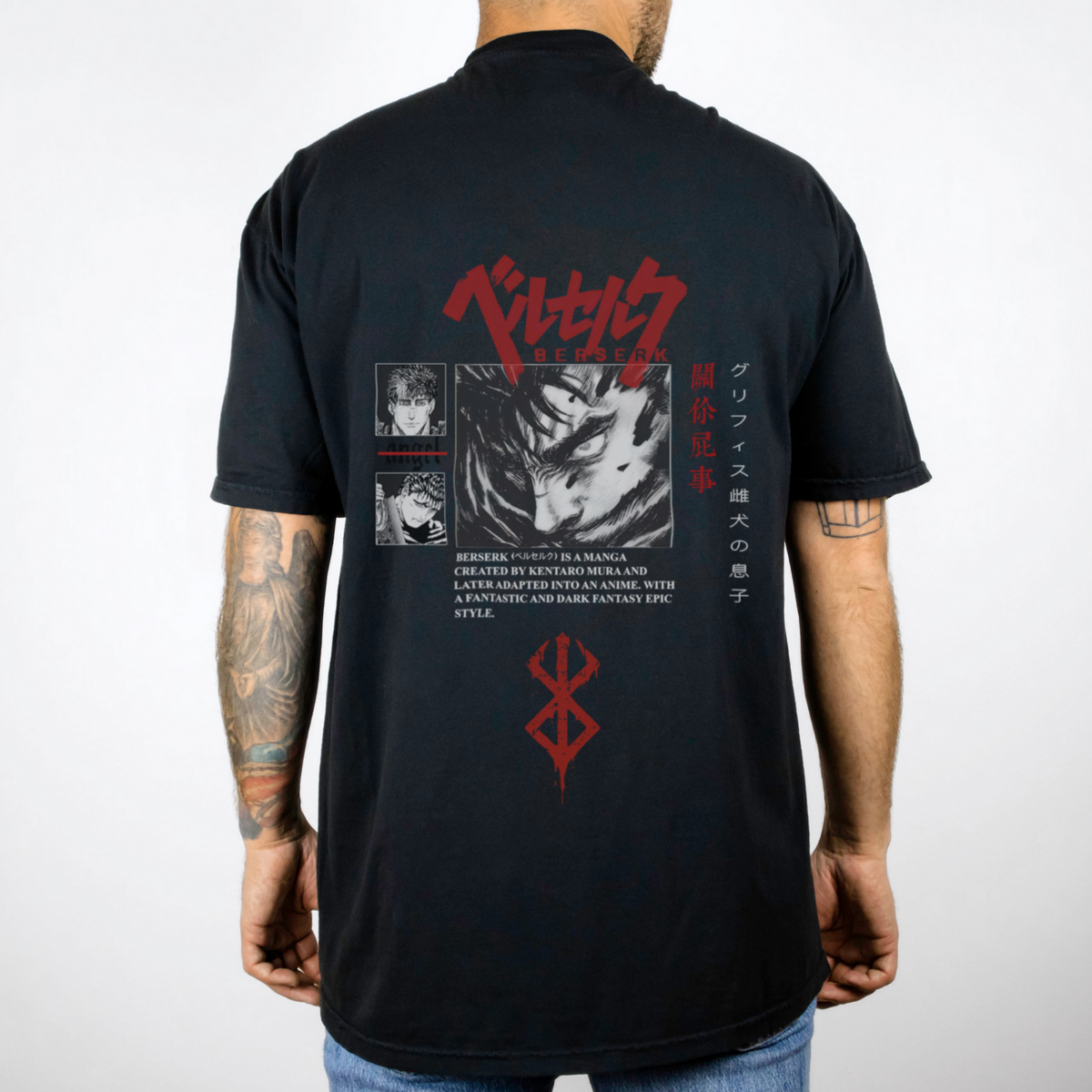 a man wearing a black shirt with a picture of a demon on it