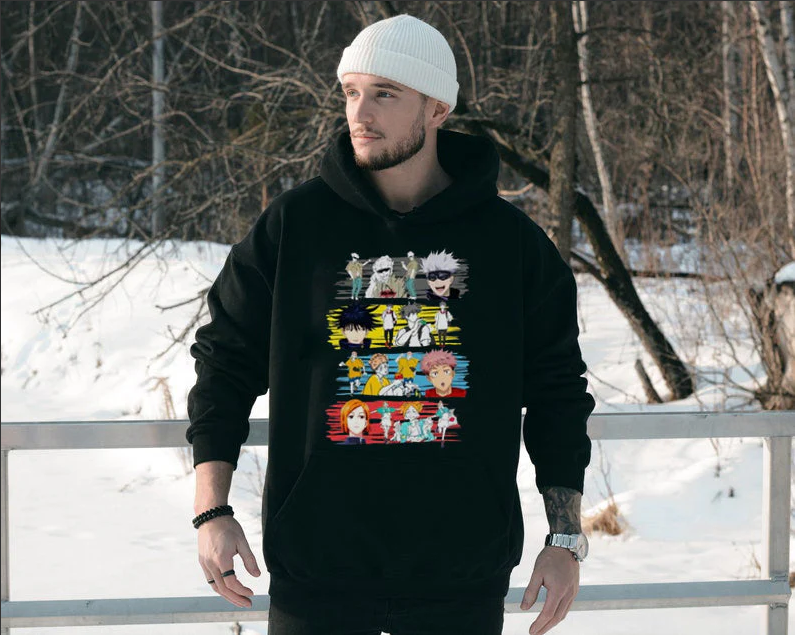 a man wearing a black hoodie with anime characters on it