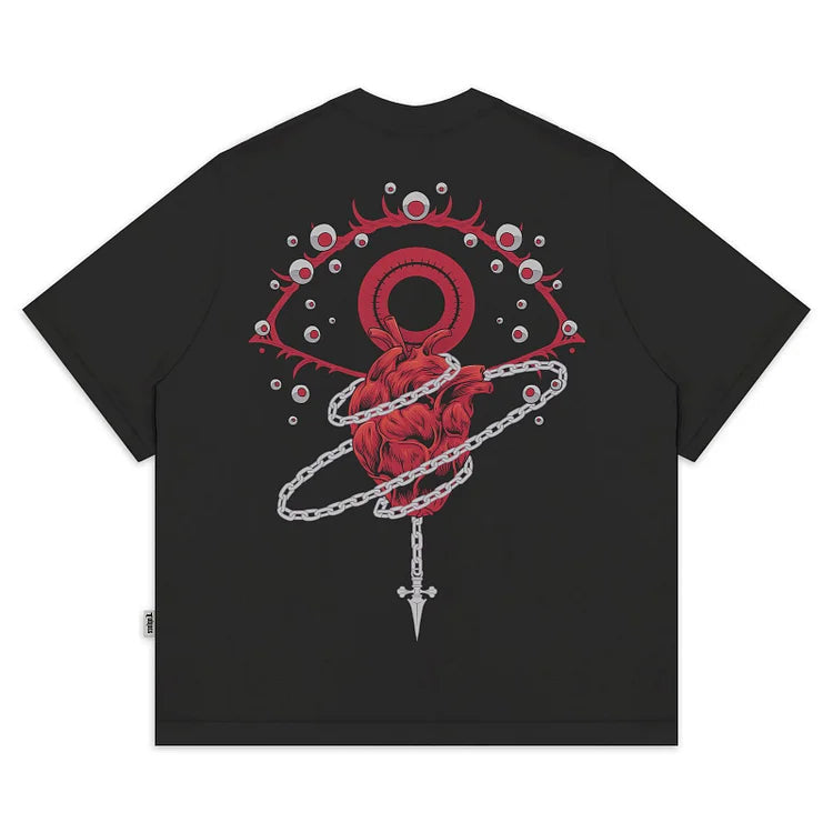 a black t - shirt with a red heart on it