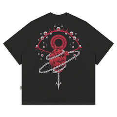 a black t - shirt with a red heart on it