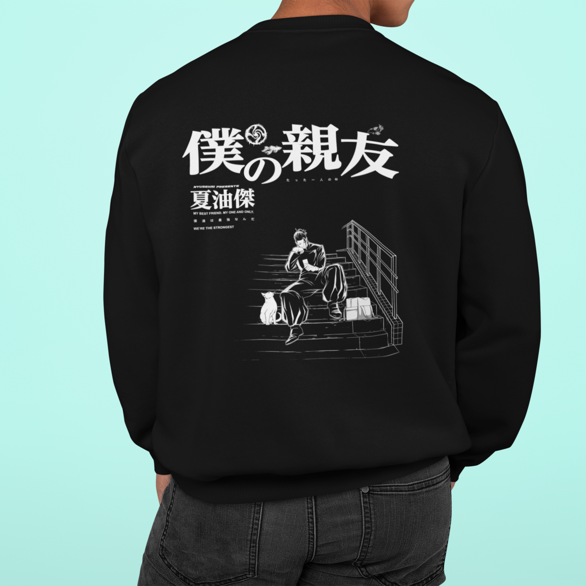 a man wearing a black sweatshirt with an image of a man sitting on a bench