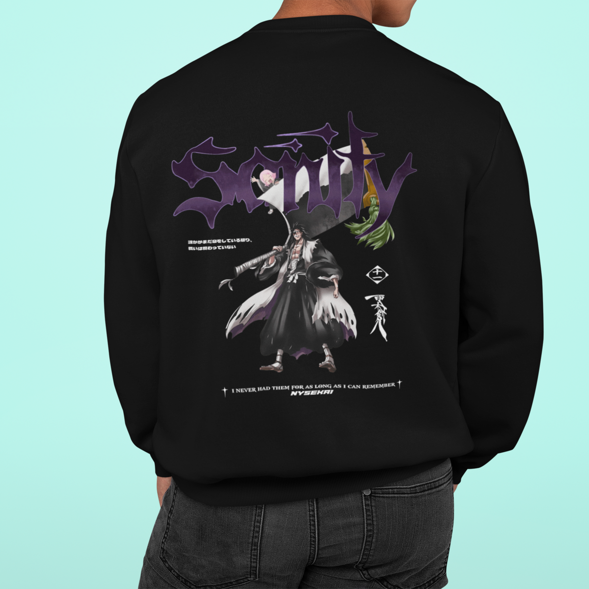 a man wearing a black hoodie with a picture of a demon on it