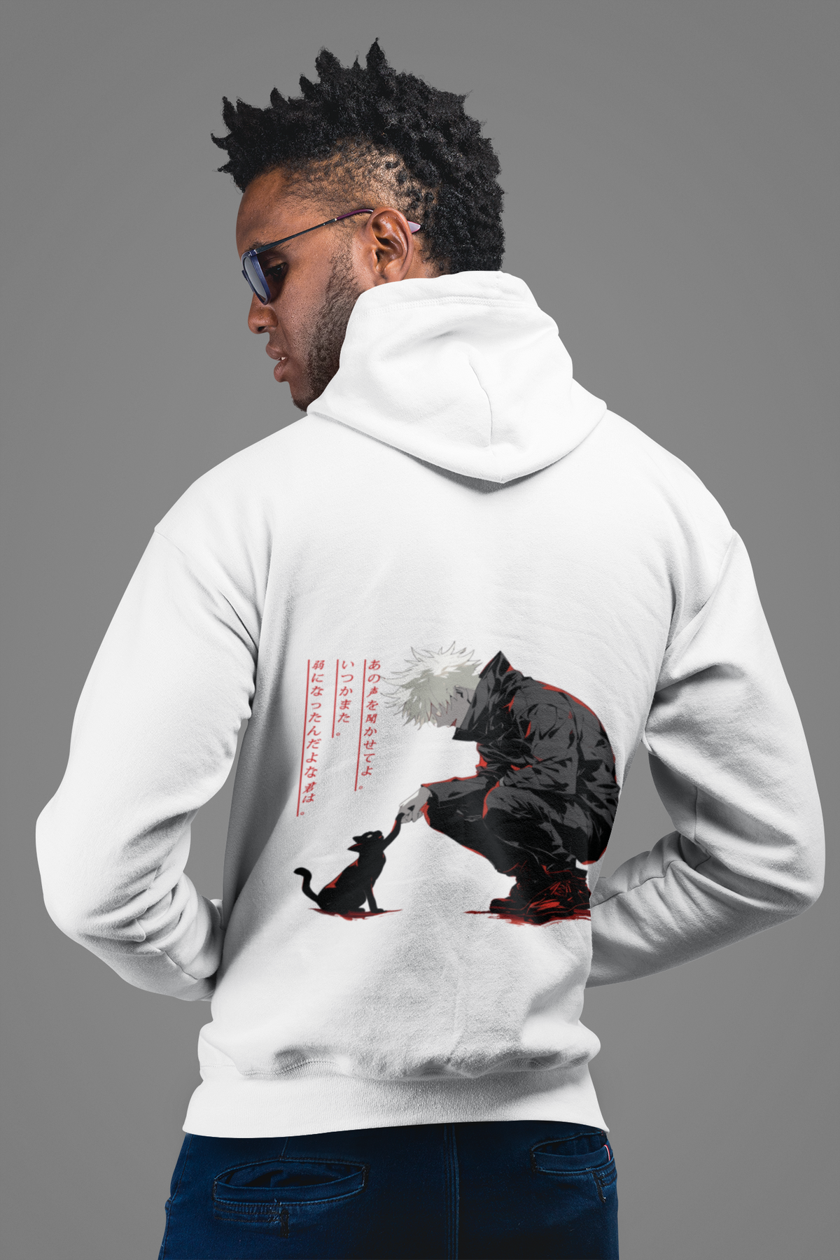 a man wearing a white hoodie with a black dog on it